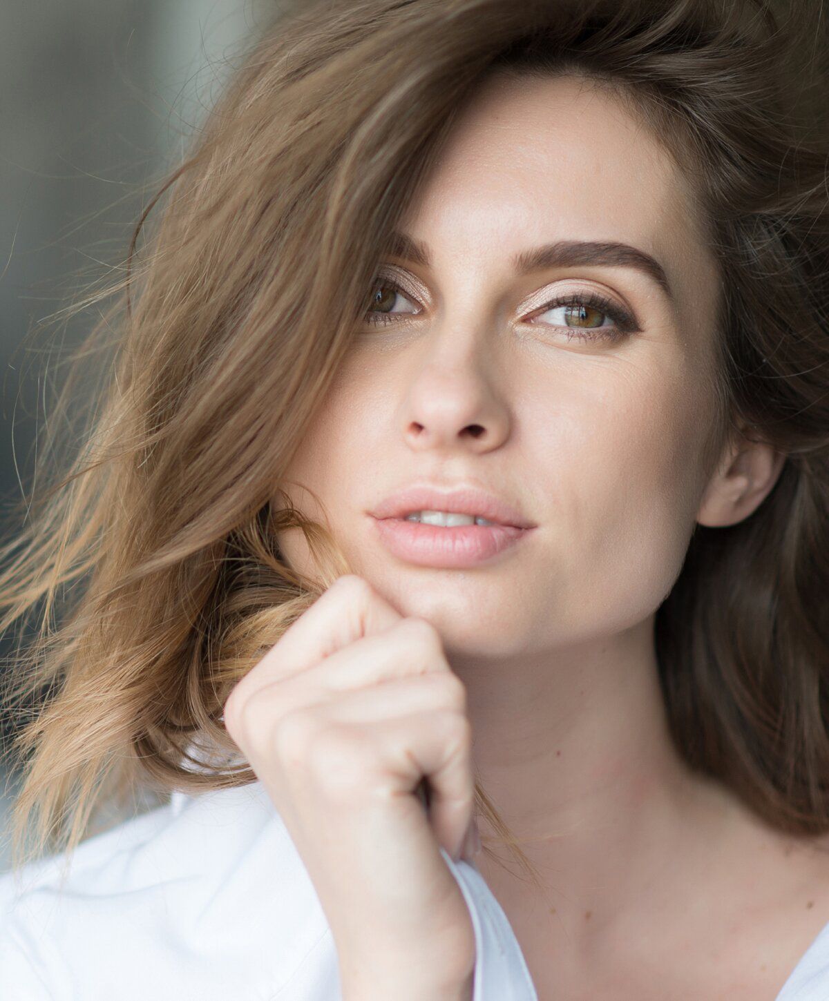 Close-up of woman with thoughtful expression.